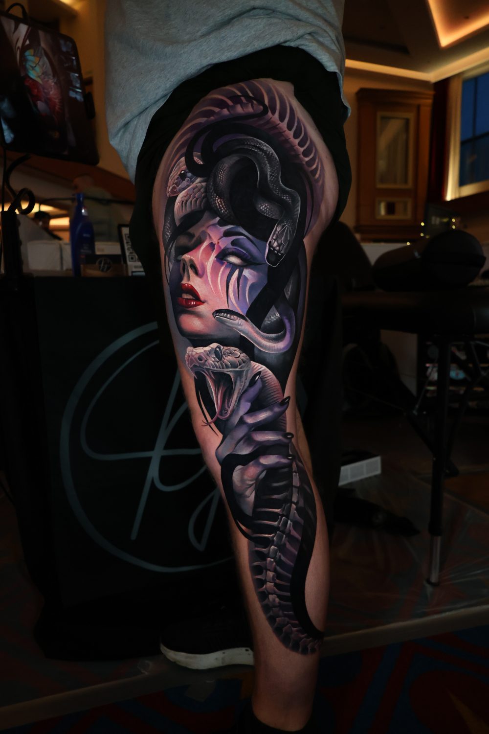 Medusa and striking cobra surrealism full leg tattoo by Kimmi Gayle