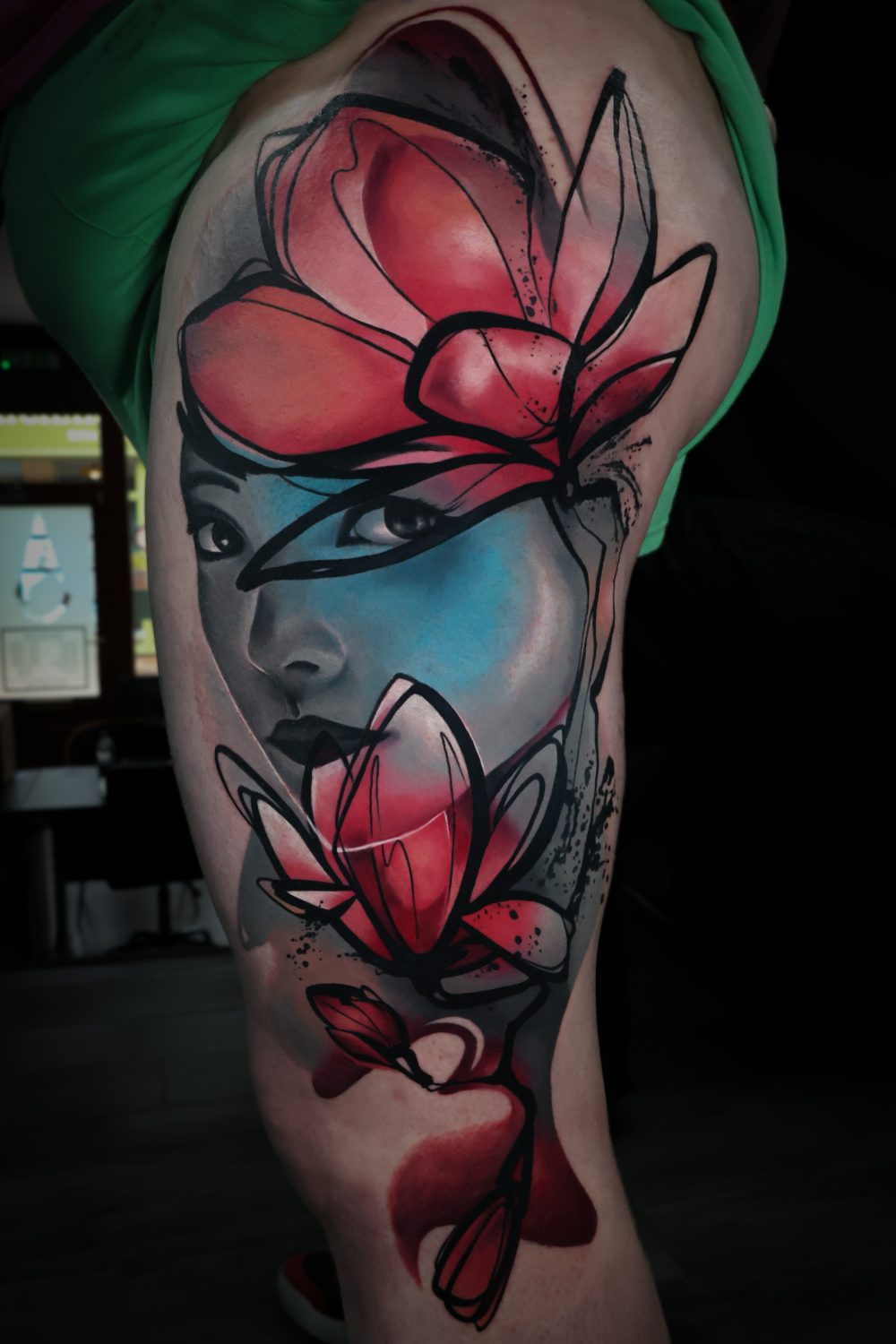 Portrait and magnolia surrealism thigh tattoo by Kimmi Gayle
