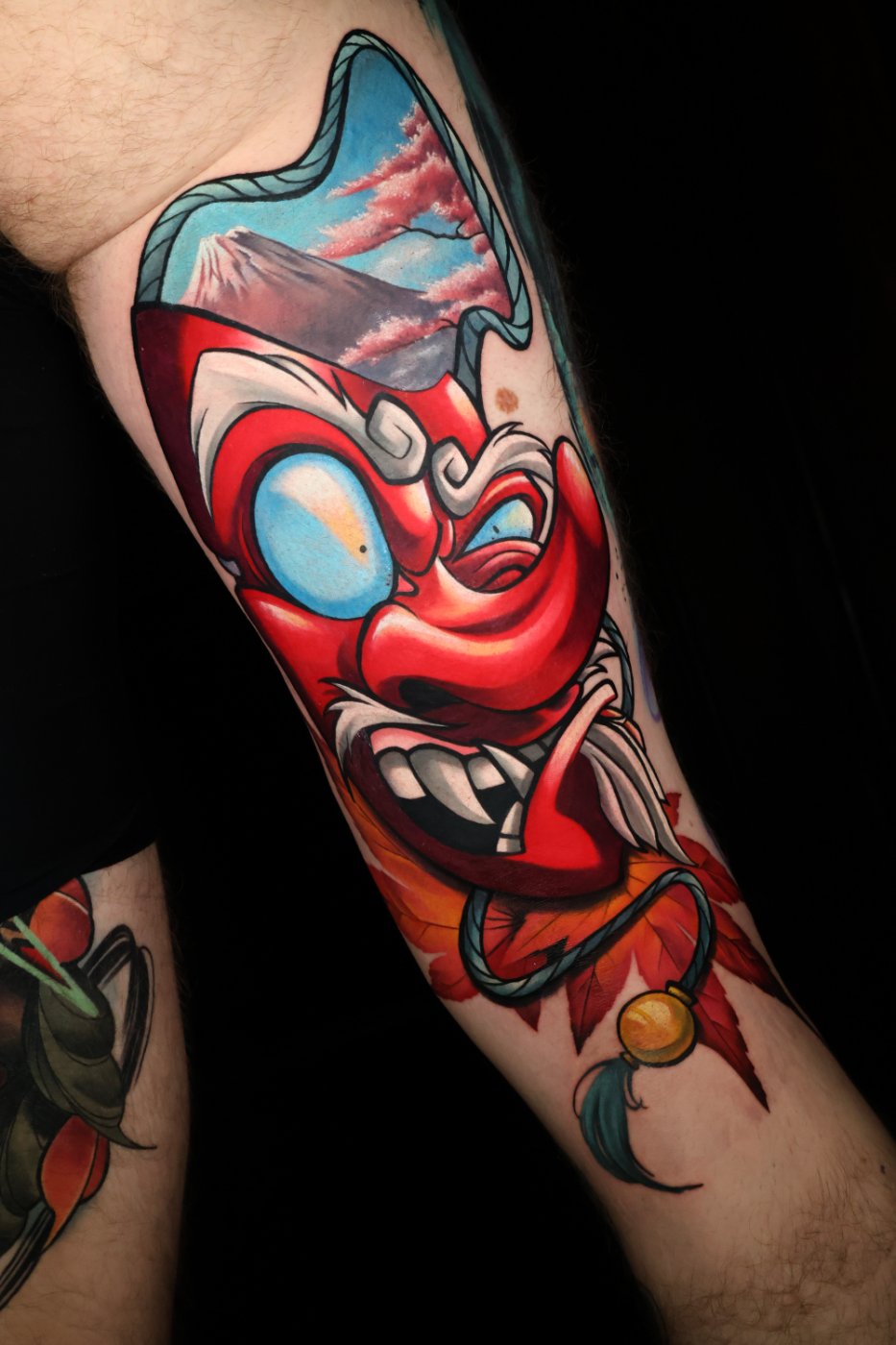 Tengu mask and Mount Fuji neo-traditional tattoo by Kimmi Gayle