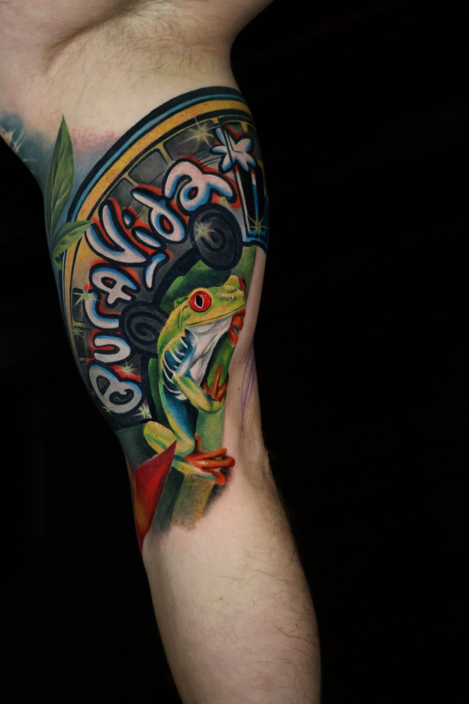 Tree frog and lettering colour realism tattoo by Kimmi Gayle, Derby