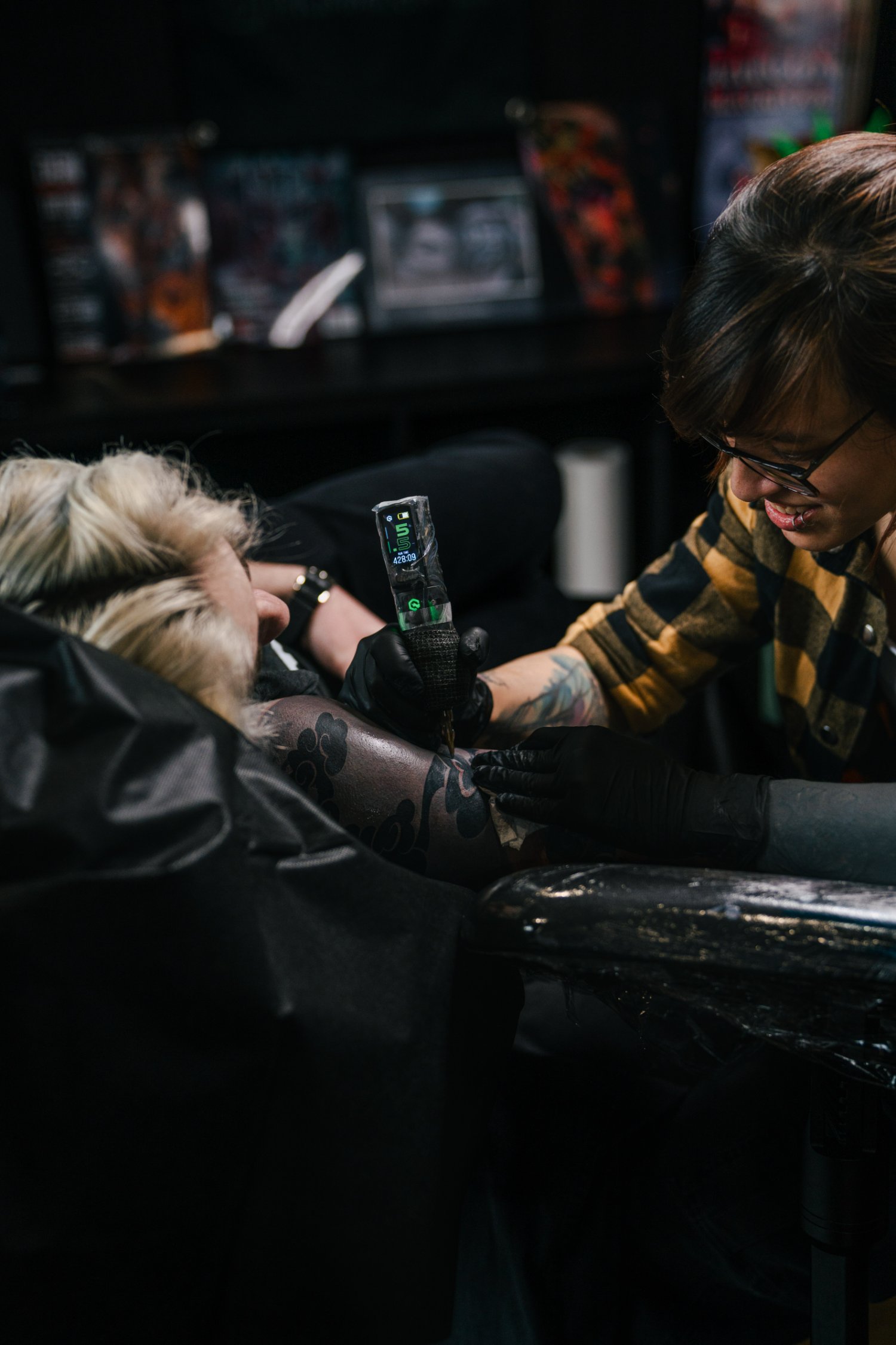 Kimmi Gayle tattooing a client at The Grey Heron studio, Derby